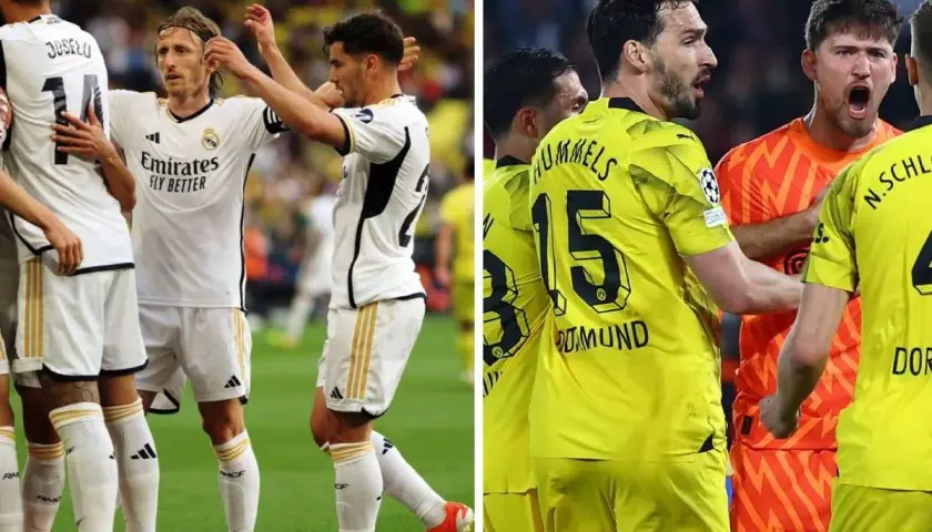Piłkarze Realu Madryt w białych strojach i Borussii Dortmund w żółtych, w emocjach po meczu.